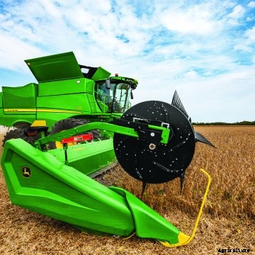 A model year 2022 John Deere S Series combine harvests soybeans