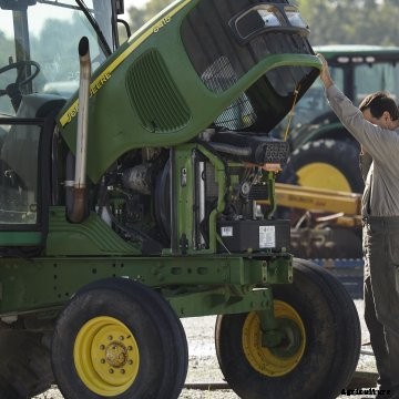 Man examining tractor for sale