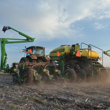 A John Deere planter planting soybeans.