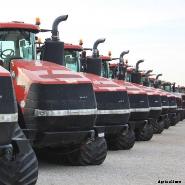 Tracked tractors at an auction.