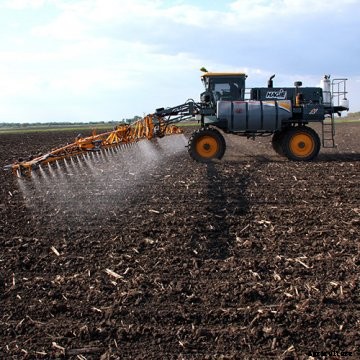 A Hagie sprayer in a field.