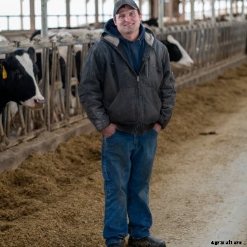 Brad Kruger standing in a barn